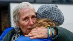 Figure caption, Watch: Evacuees from Oleshky reunited with their families