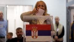 Image caption, People queue outside a polling station in Novi Sad, Serbia's second-largest city
